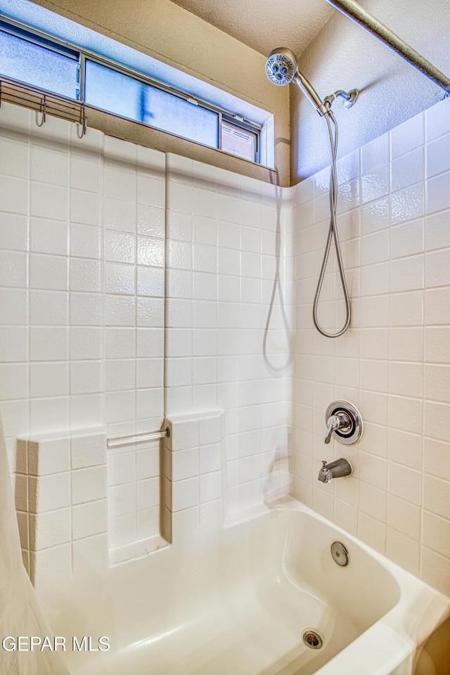 bathroom with shower / tub combination