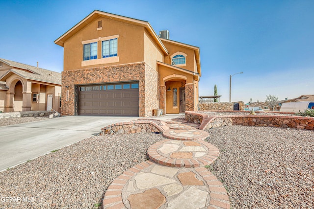 view of front of property with a garage and central air condition unit