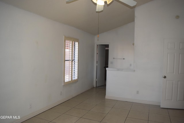 unfurnished room featuring light tile patterned floors, vaulted ceiling, and ceiling fan