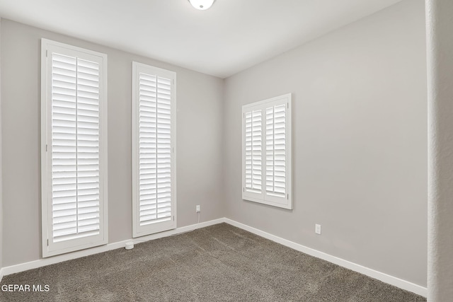 empty room with carpet flooring