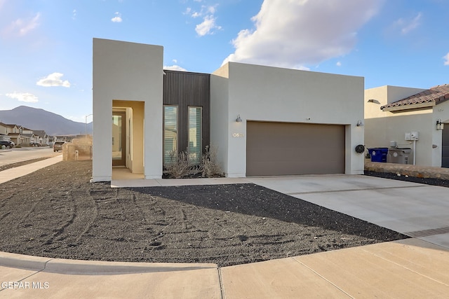 view of front of house with a mountain view and a garage