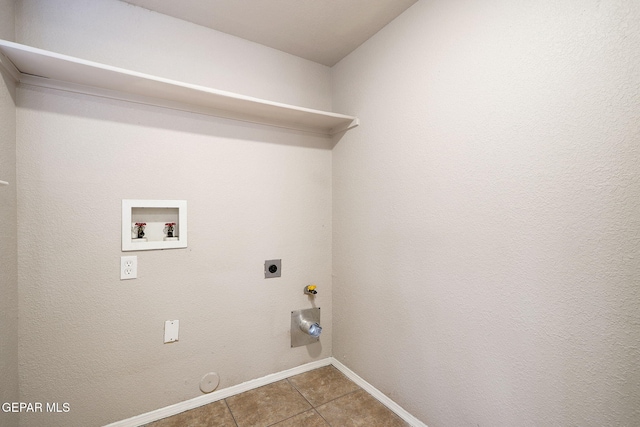 clothes washing area with tile patterned floors, hookup for an electric dryer, hookup for a gas dryer, and hookup for a washing machine