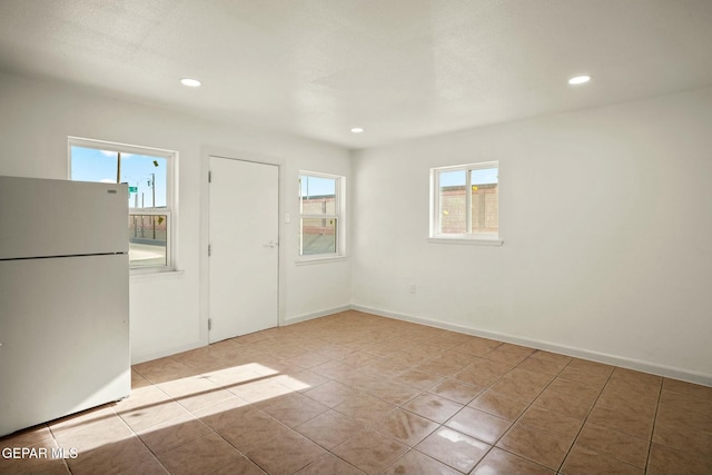 spare room with light tile patterned floors