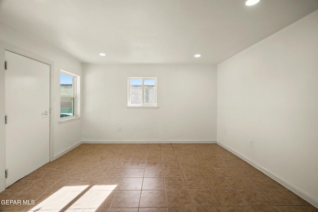 unfurnished room featuring light tile patterned floors