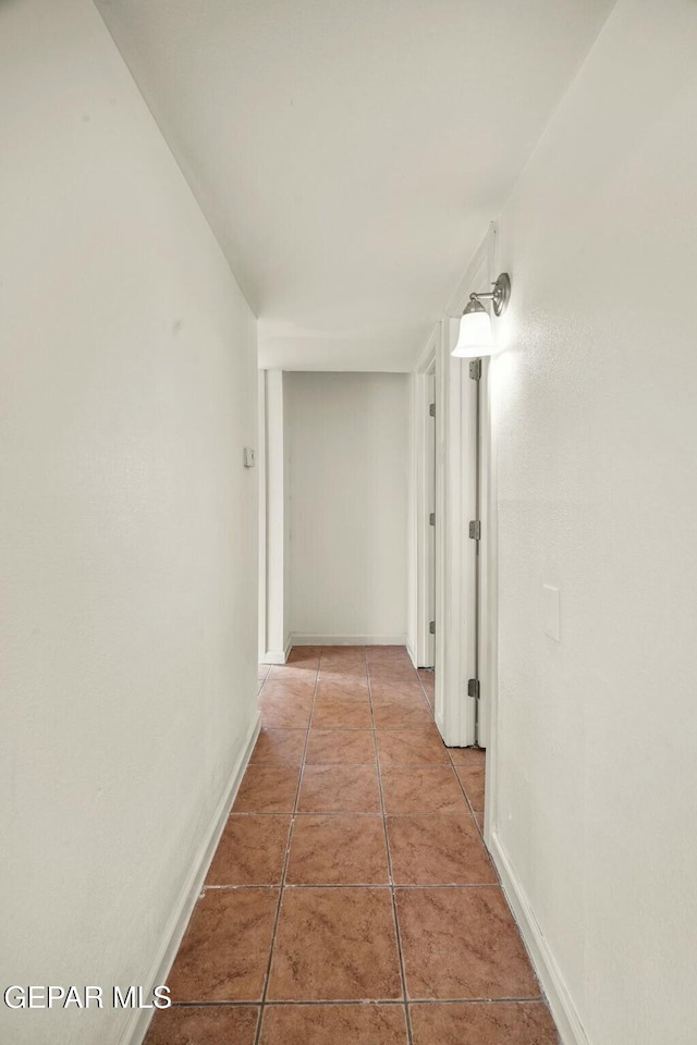 corridor featuring tile patterned flooring