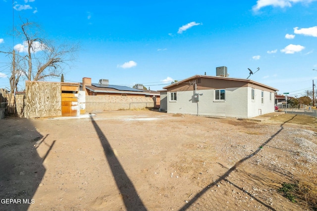 back of house with cooling unit