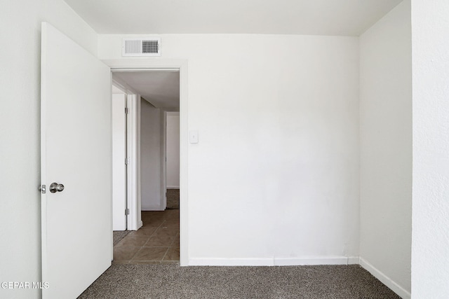 241 Mango Rd, El Paso, TX 79915 - carpeted empty room with baseboards, tile patterned flooring, and visible vents