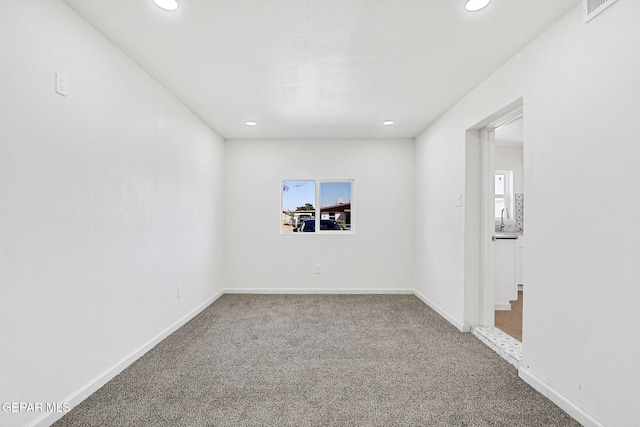 241 Mango Rd, El Paso, TX 79915 - carpeted empty room featuring a wealth of natural light, recessed lighting, and visible vents