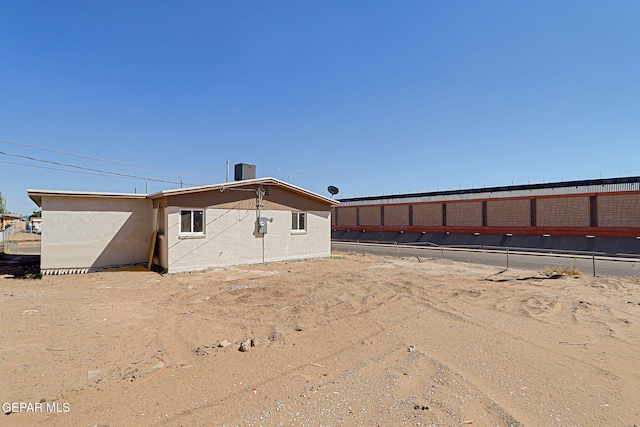 241 Mango Rd, El Paso, TX 79915 - back of house featuring fence and cooling unit