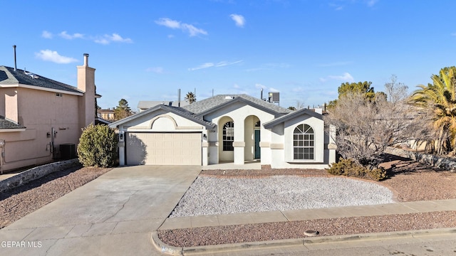 view of front of house featuring central AC and a garage