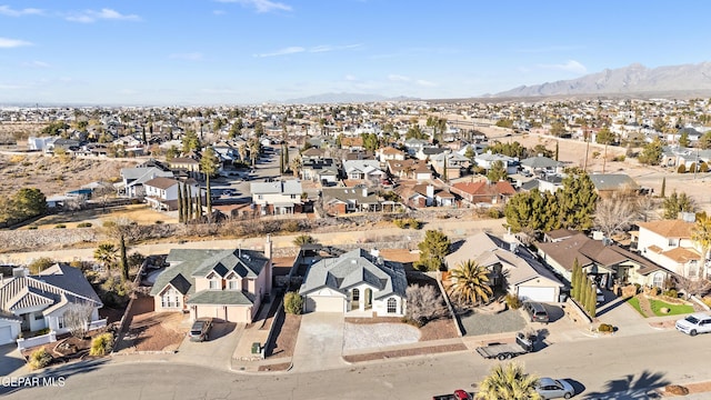 birds eye view of property with a mountain view