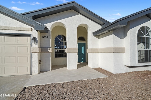 property entrance with a garage