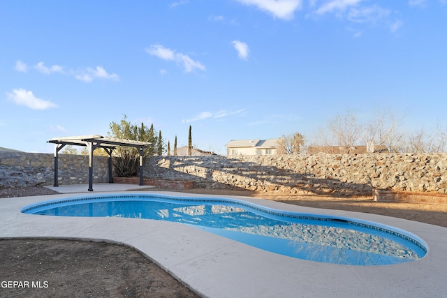 view of swimming pool featuring a pergola