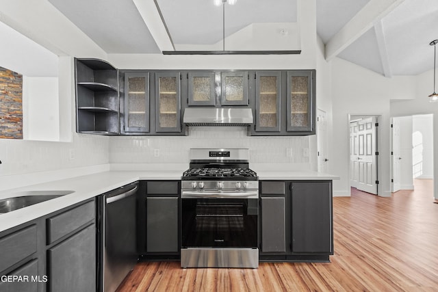 kitchen with pendant lighting, sink, vaulted ceiling with beams, stainless steel appliances, and light hardwood / wood-style flooring