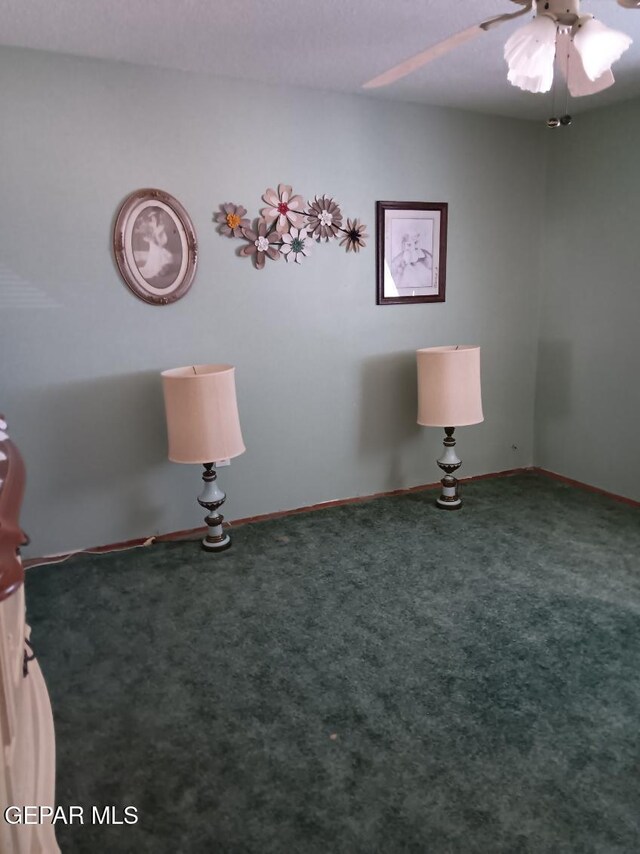 interior space with ceiling fan