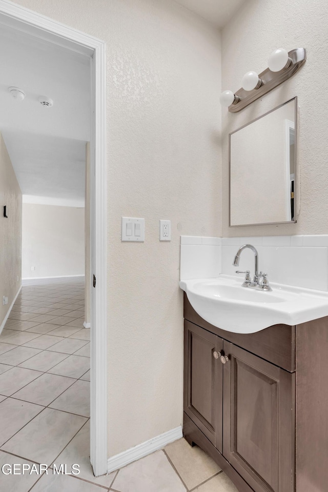 bathroom with vanity and tile patterned flooring