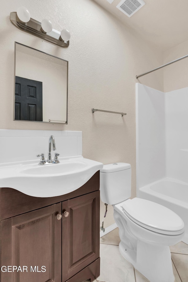 full bathroom featuring washtub / shower combination, vanity, tasteful backsplash, tile patterned floors, and toilet