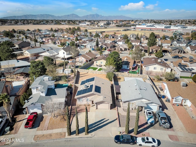 birds eye view of property featuring a mountain view