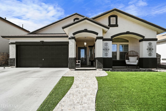 view of front of property with a garage and a front yard