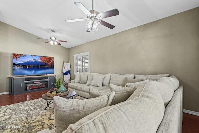 living room with vaulted ceiling, ceiling fan, and dark hardwood / wood-style flooring