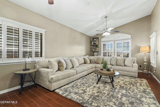 living room with lofted ceiling, dark hardwood / wood-style floors, and ceiling fan