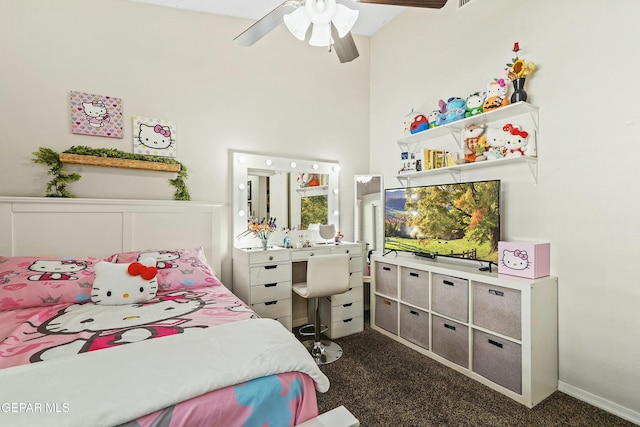 carpeted bedroom featuring a towering ceiling and ceiling fan