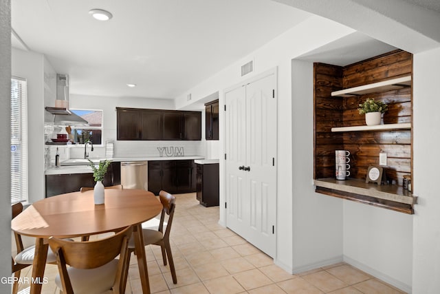 dining space featuring light tile patterned flooring