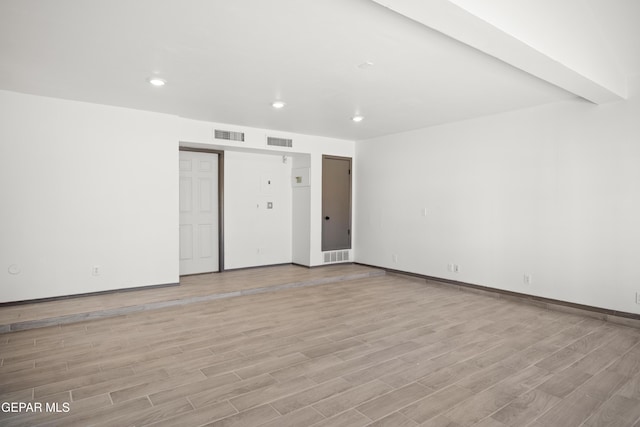 unfurnished room with light hardwood / wood-style flooring