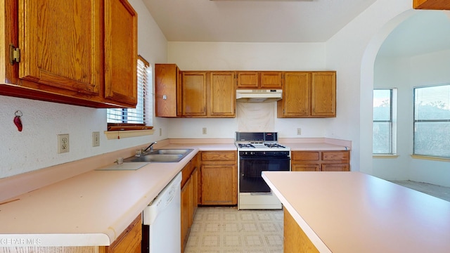 kitchen with white appliances and sink