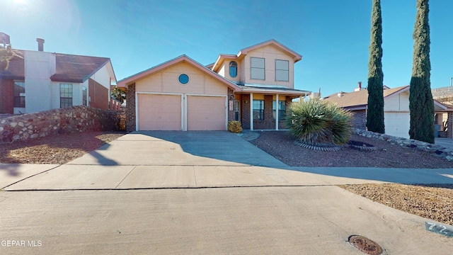 view of front property with a garage and covered porch