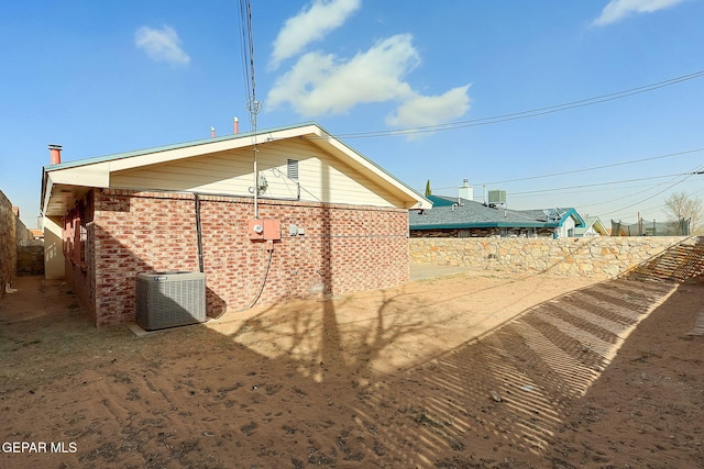 back of property with central air condition unit