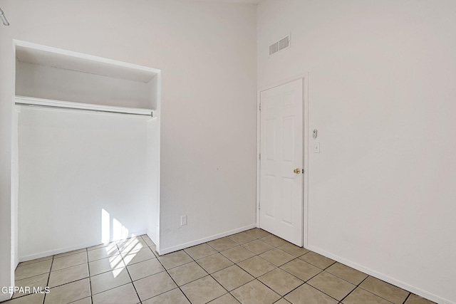 unfurnished bedroom featuring light tile patterned flooring