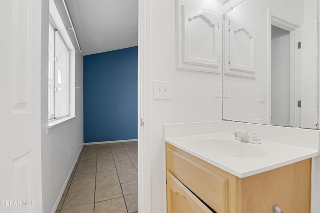 bathroom with vanity and tile patterned flooring