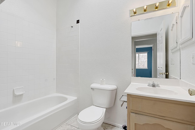 full bathroom featuring vanity, toilet, tiled shower / bath combo, and tile patterned flooring