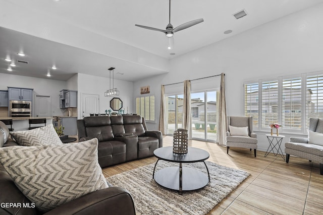 living room with a wealth of natural light and ceiling fan