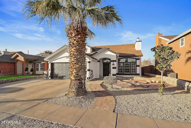 ranch-style home featuring a garage