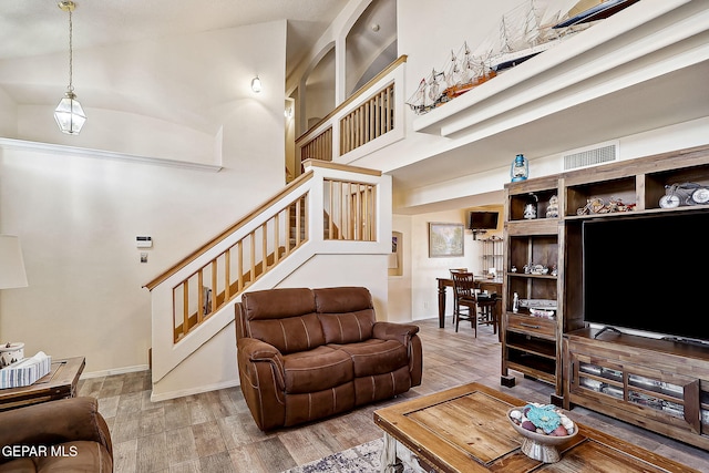 living room featuring a high ceiling