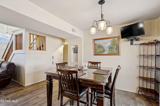 dining area featuring hardwood / wood-style flooring