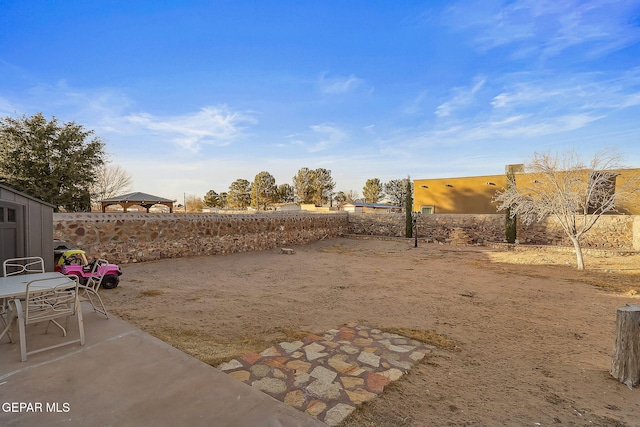 view of yard featuring a gazebo and a patio area