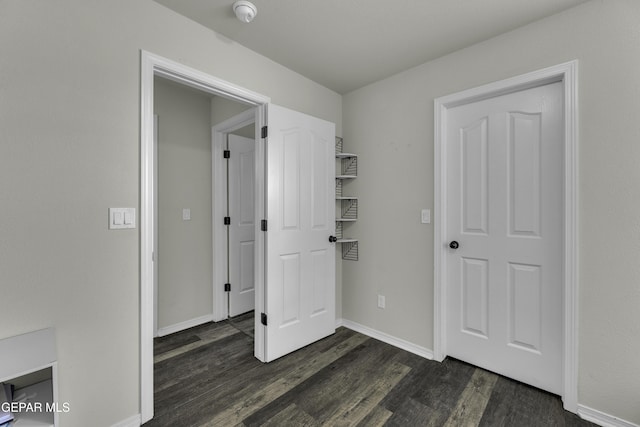 interior space with dark hardwood / wood-style flooring