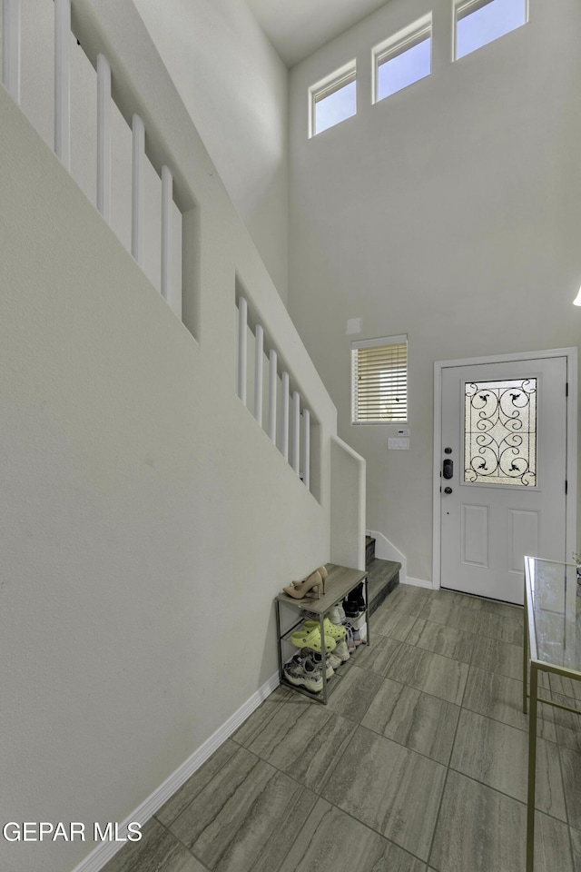 foyer with a towering ceiling