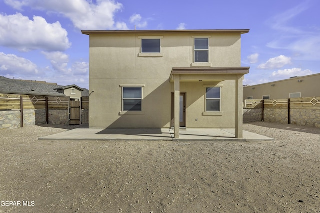 back of house featuring a patio