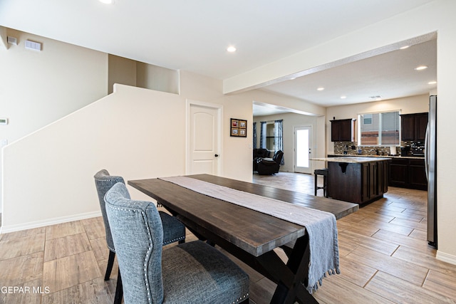 dining room with beam ceiling