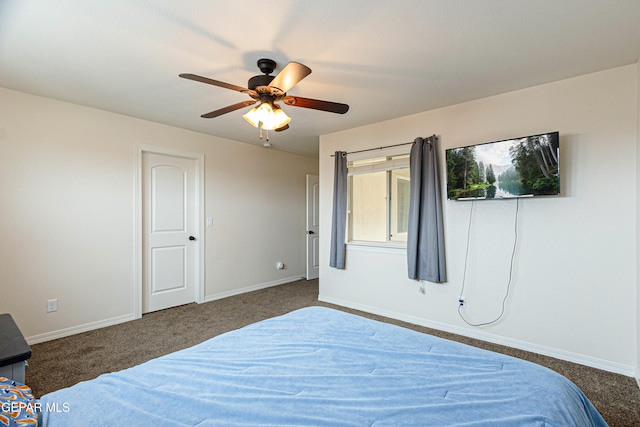 bedroom featuring ceiling fan and dark colored carpet