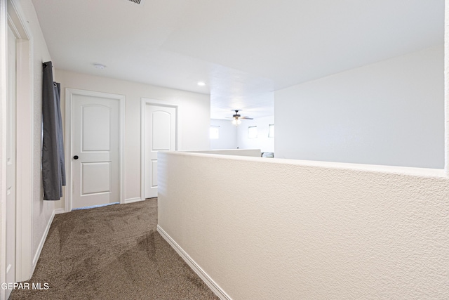 hallway featuring carpet flooring