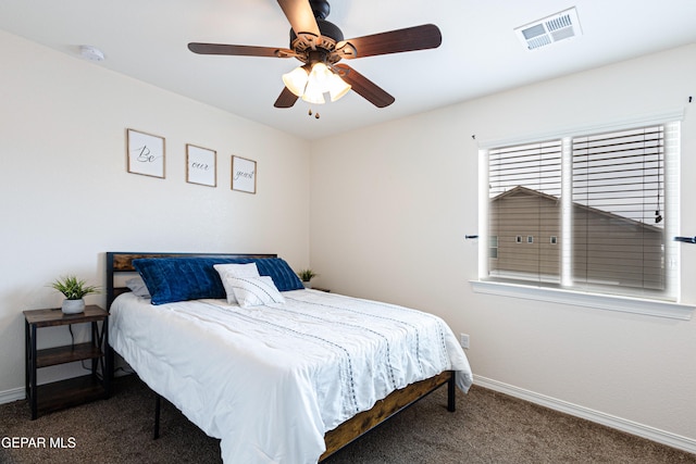 bedroom with dark carpet and ceiling fan