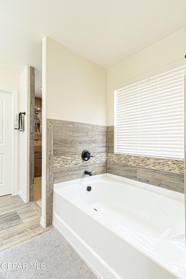 bathroom with independent shower and bath