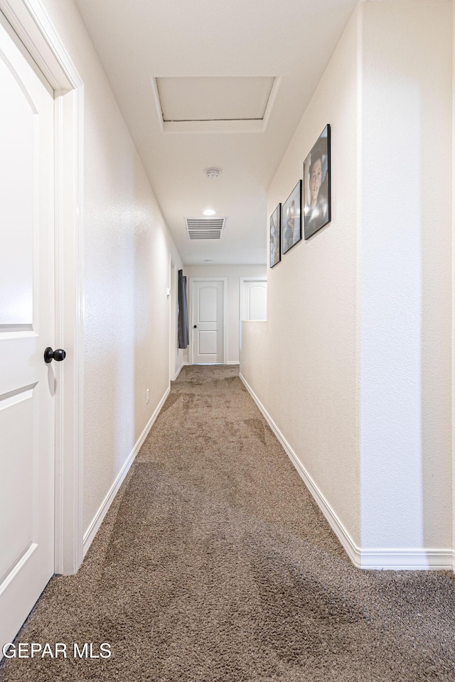 corridor featuring carpet flooring