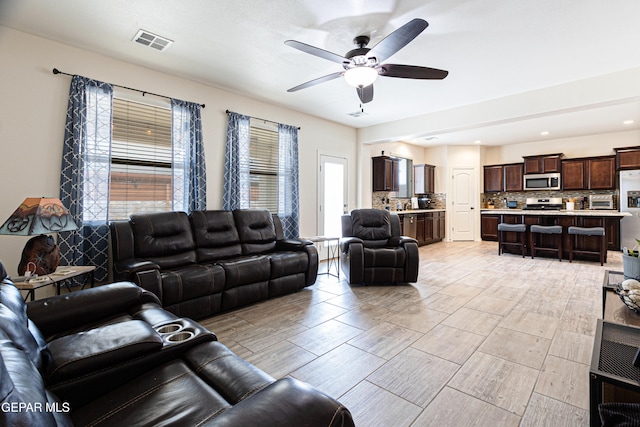 living room featuring ceiling fan