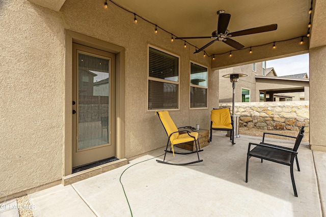 view of patio featuring ceiling fan